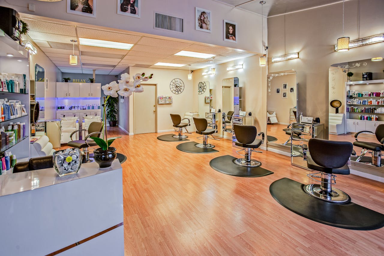 our-experience Spacious and stylish hair salon interior in Del Mar, CA showcasing chic design.